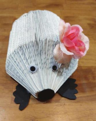 Tuesday night at Oakalla Library’s Art Hour, artists recycled discarded books for the art of book folding. They made hedgehogs. Contributed