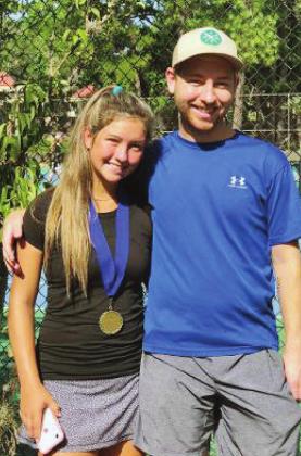 Zaida Freeman poses for a picture with her brother Zane after winning the Horseshoe Bay tennis championship in July. The tournament was the first since the COVID-19 cancellations of sporting events. Contributed