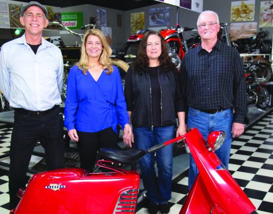 (From left) Motorcycle connoisseur Mark Scott, Lisa Whelchel, Janell Hanlon and Pat Hanlon admire the Allstate circa 1950 scooter during the production of the recent “Collector’s Call” television broadcast in Burnet. Contributed photo