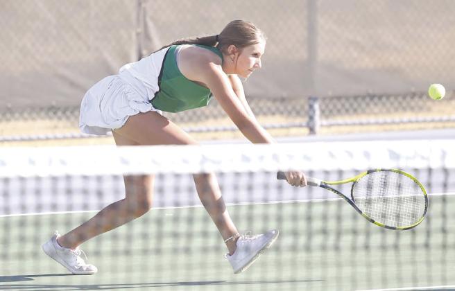 Samantha Burton stretches for a return during the fall tennis home opener on Friday versus Canyon Lake.