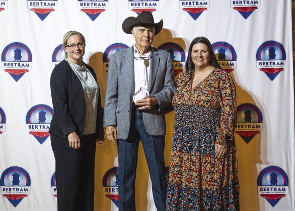 Kelly Tarla, Burnet County Agrilife Extension Agent, and Chamber Director Stephanie Fitzsimmons present Chuck Orr with the Rancher of the Year Award.