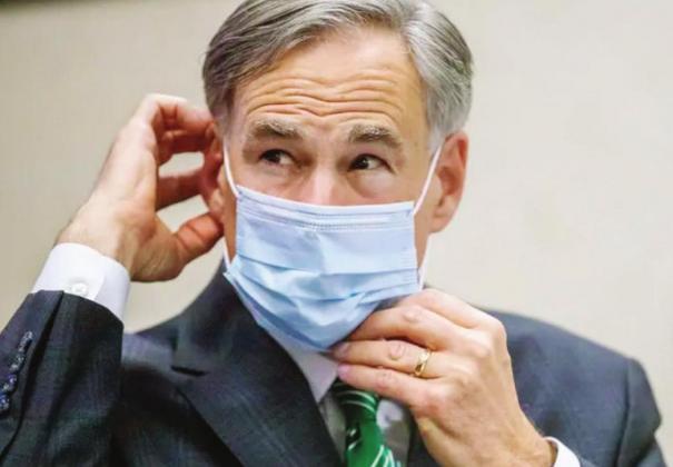 Gov. Greg Abbott extended the COVID-19 disaster declaration on Aug. 8. He emphasized the importance of wearing a face covering, such as the one in this July photo, and social distancing. AA-S press pool photo