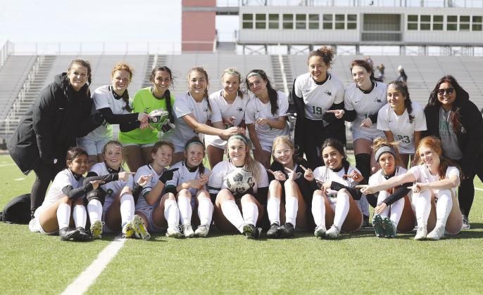 The Lady Dawg soccer team moved their district record to 3-0 with a big 7-0 win over Jarrell. Pictured above the team celebrates with their selected game MVP, Lainey Rye, center.