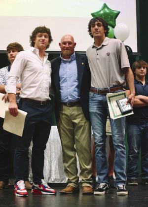 Burnet baseball coach Russell Houston poses with the recipients of his Cy Young award, Dash Denton and Braden Ellett-Clark, at last week’s program honoring Burnet’s student athletes.