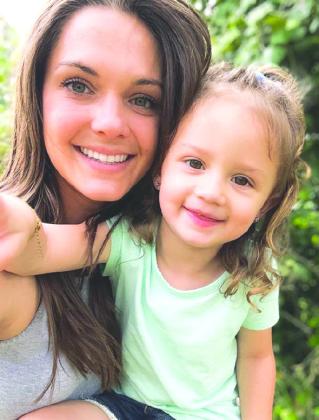 Allison Eaton, pictured here with her three-year old daughter Emery Liv, has returned home to Burnet and will be the new head softball coach as well as assistant volleyball coach.